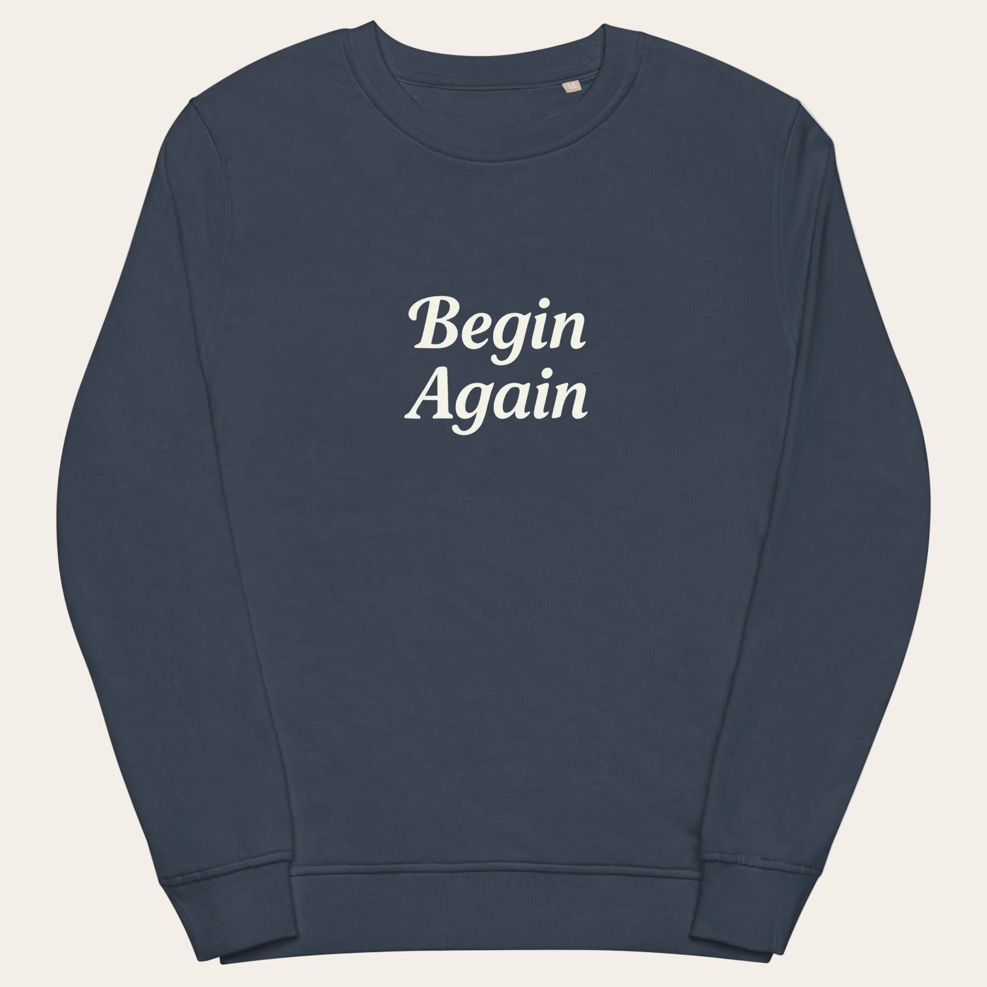 Navy blue sweatshirt with 'Begin Again' text on a white background