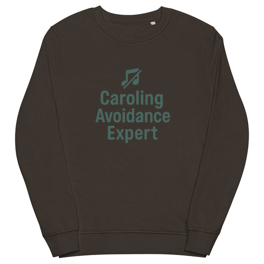 Brown sweatshirt with 'Caroling Avoidance Expert' text and music note icon on a white background