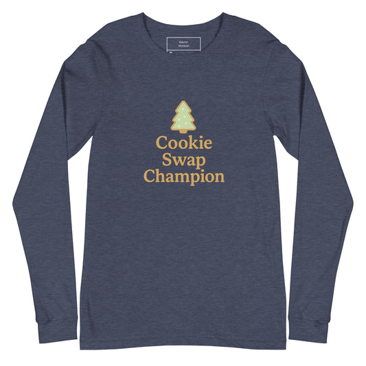 Navy long-sleeve shirt with 'Cookie Swap Champion' text and tree graphic on a white background
