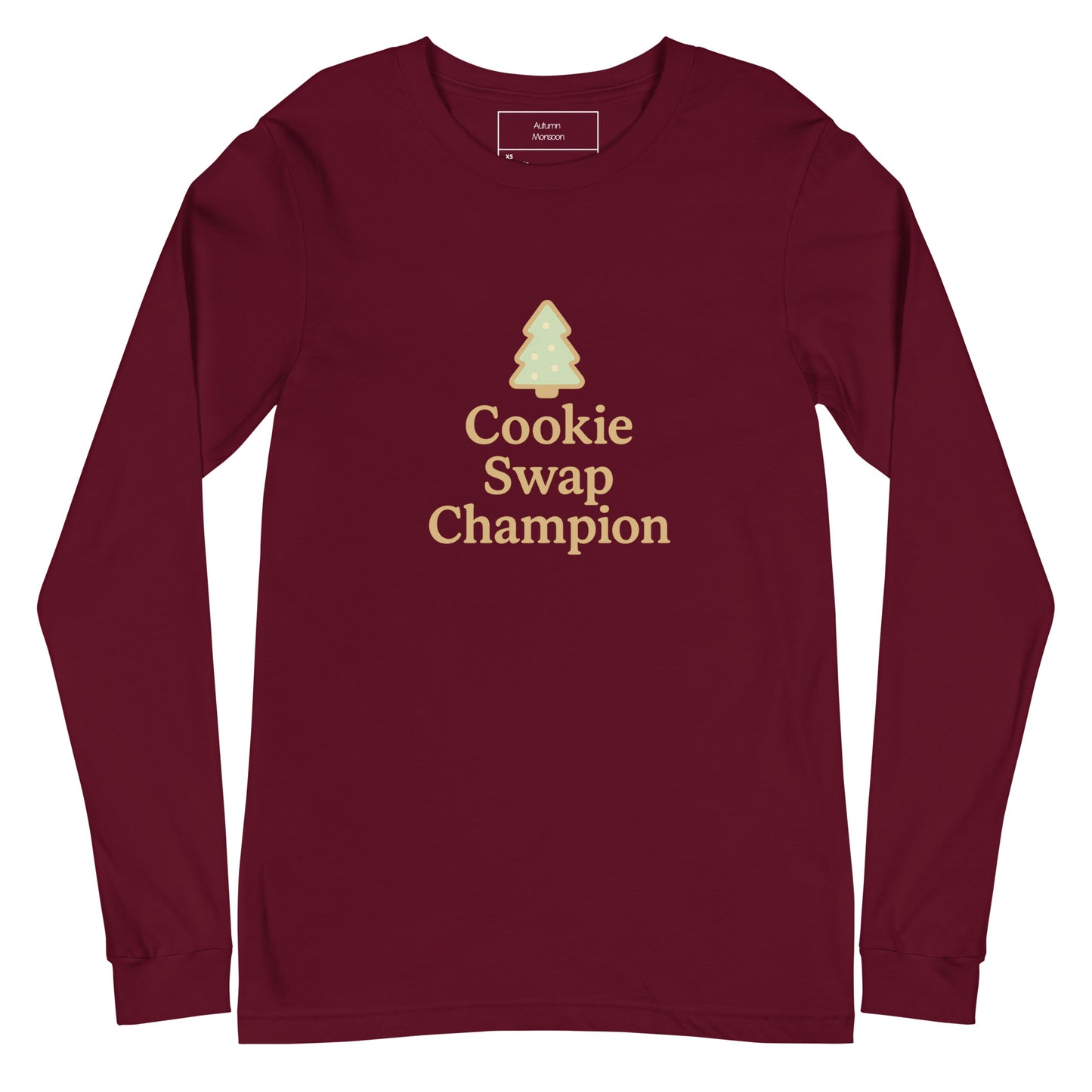 Maroon long-sleeve shirt with 'Cookie Swap Champion' text and tree graphic on a white background