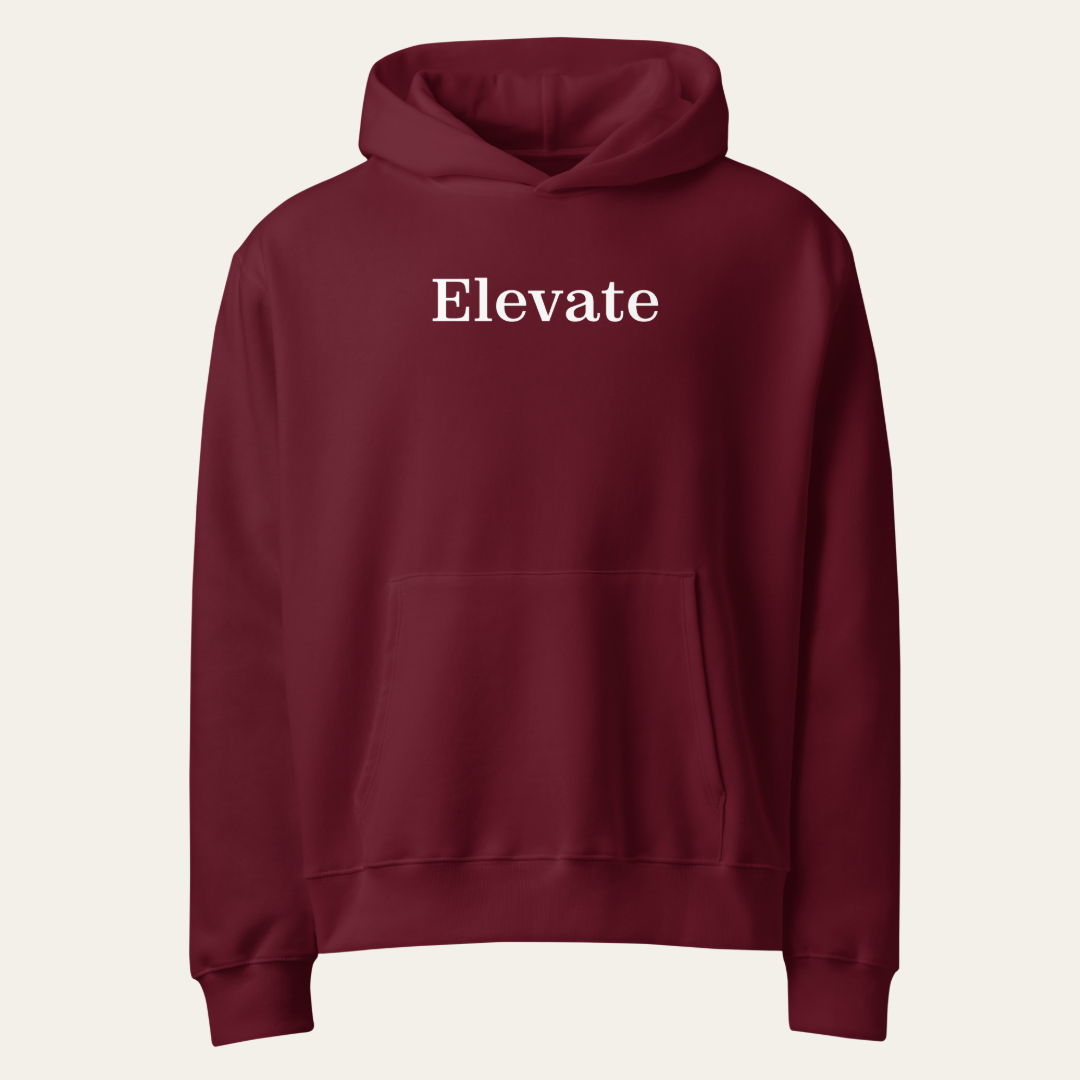 A maroon pullover hoodie with the word 'Elevate' printed in white serif font across the chest, displayed on a light off-white background.