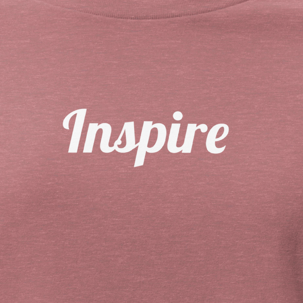 Mauve t-shirt with 'Inspire' text on a white background