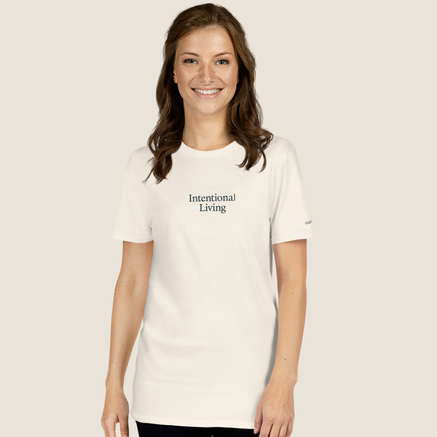 Cream t-shirt with "Intentional Living" on chest with text on left sleeve.
