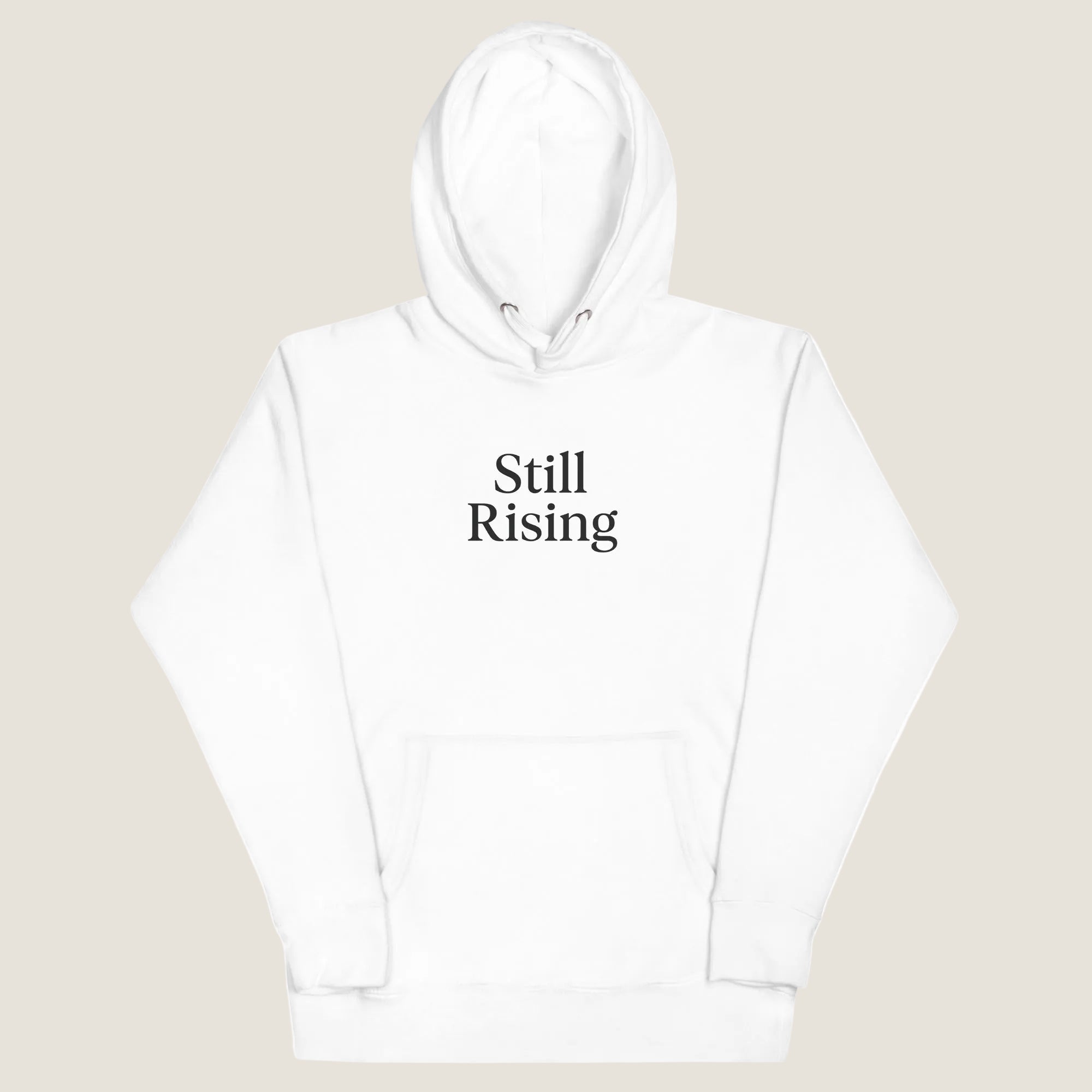 White hoodie with 'Still Rising' text on a white background