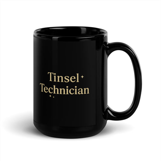 Black mug with 'Tinsel Technician' text on a white background