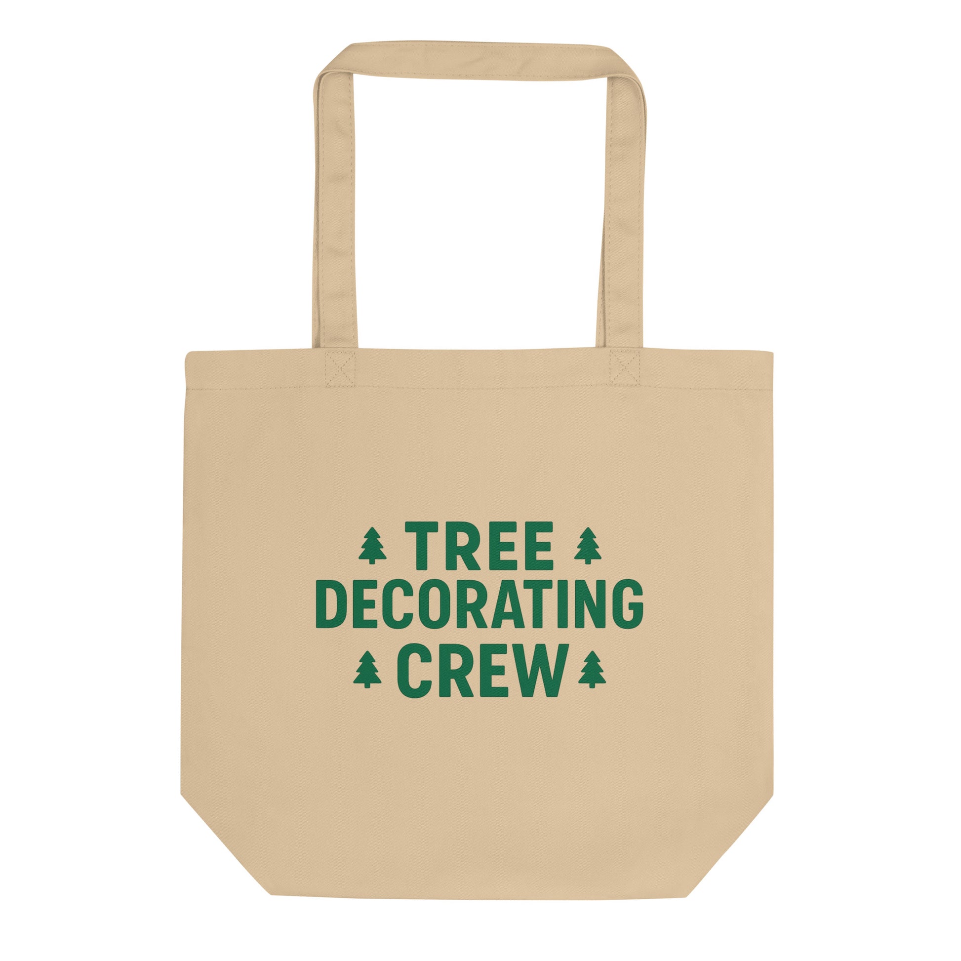 Beige tote bag with 'Tree Decorating Crew' text and Christmas tree icons on a white background
