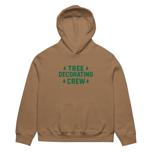 Brown hoodie with 'Tree Decorating Crew' text on a white background