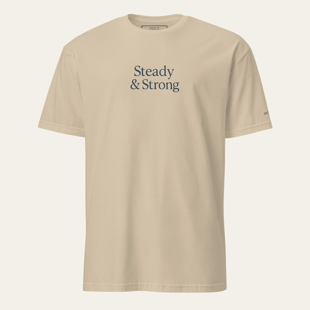 Khaki t-shirt with "Steady & Strong" on chest. Text on left sleeve