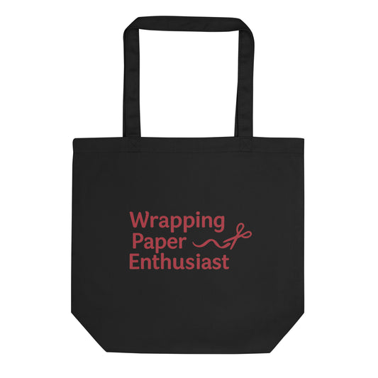 Black tote bag with red text 'Wrapping Paper Enthusiast' on a white background