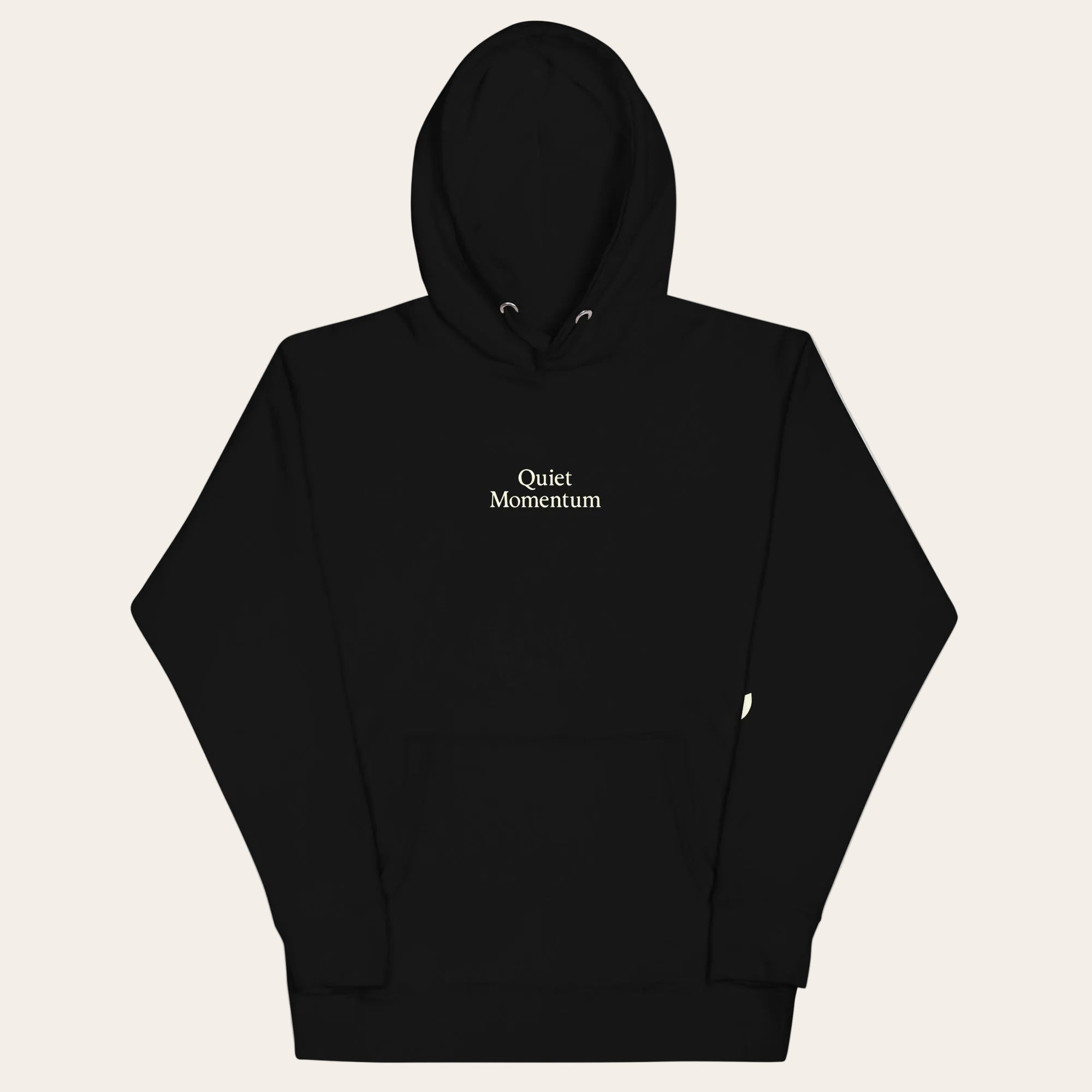 Black hoodie with 'Quiet Momentum' text on a white background