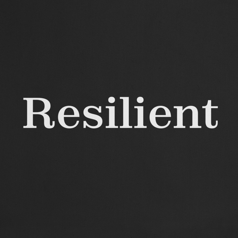 Black tote bag with 'Resilient' text on a white background