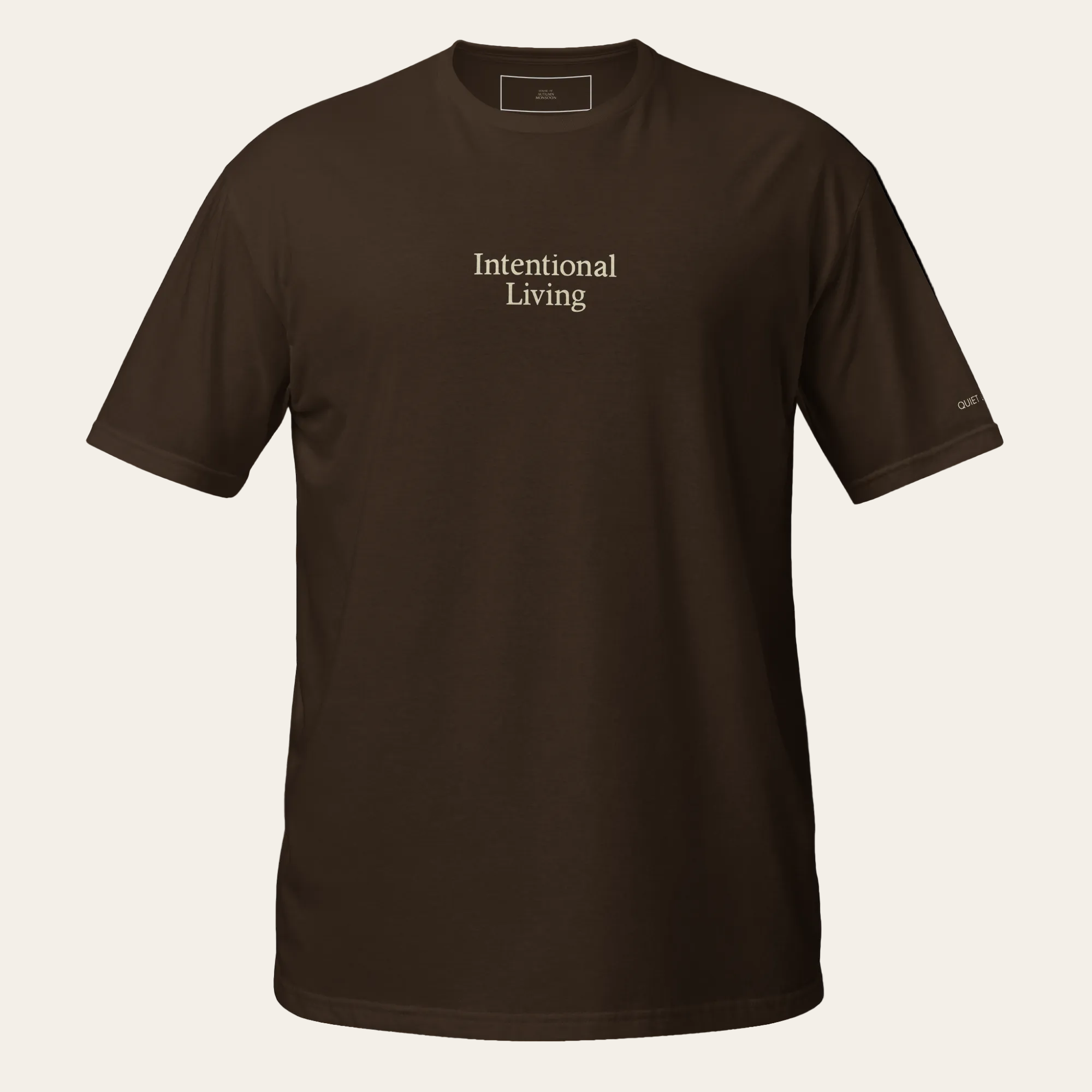 Brown t-shirt with 'Intentional Living' text on a beige background