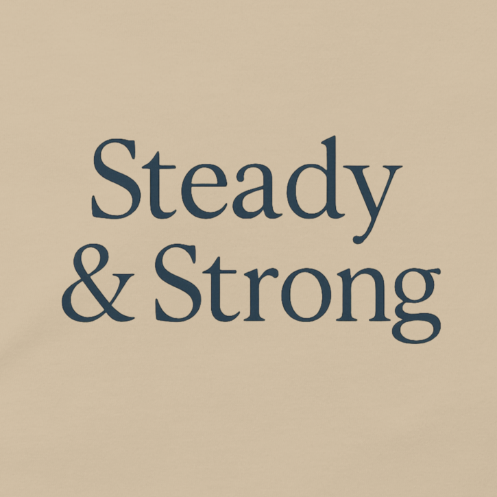 Beige t-shirt with 'Steady & Strong' text on a white background