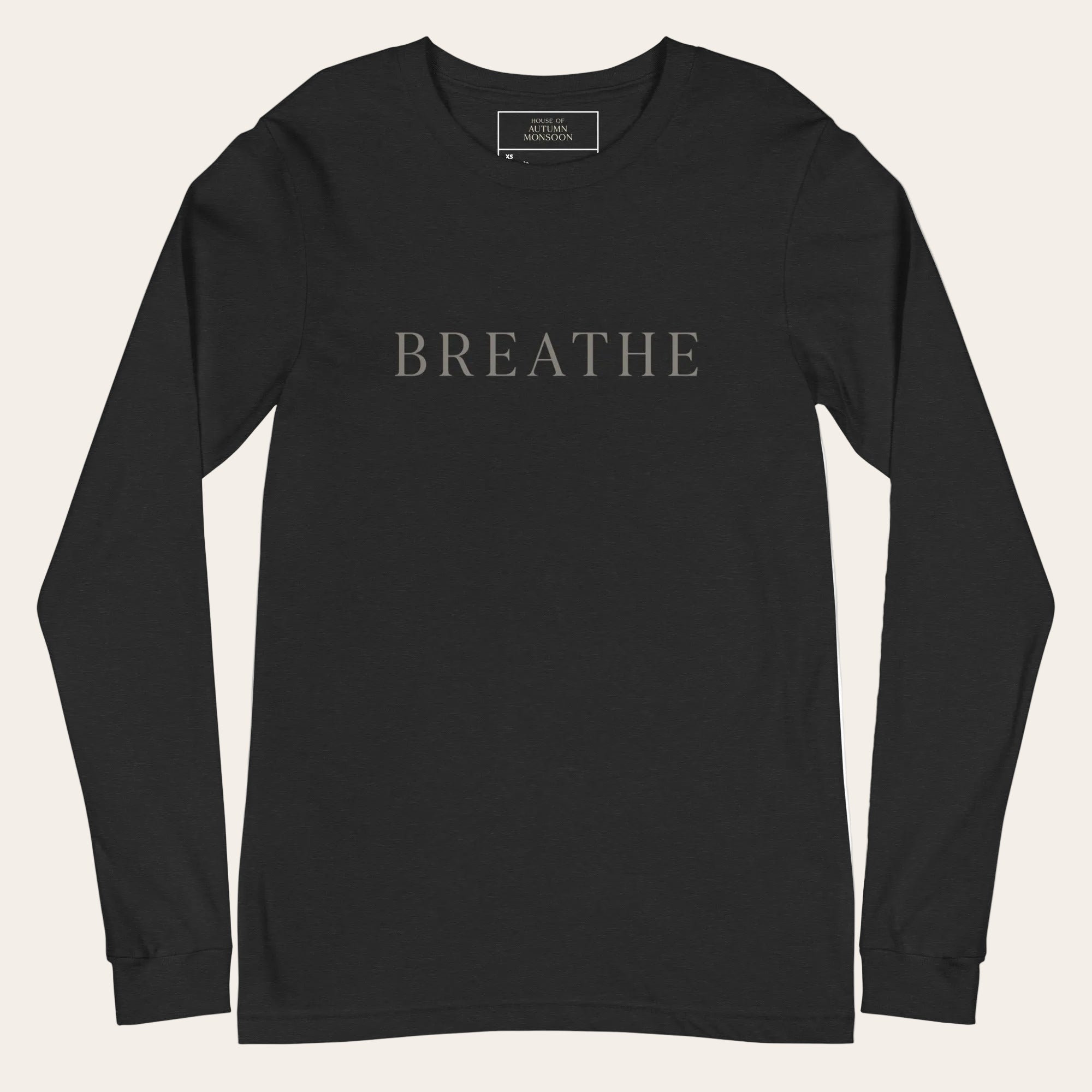 Black long-sleeve shirt with 'BREATHE' text on a white background