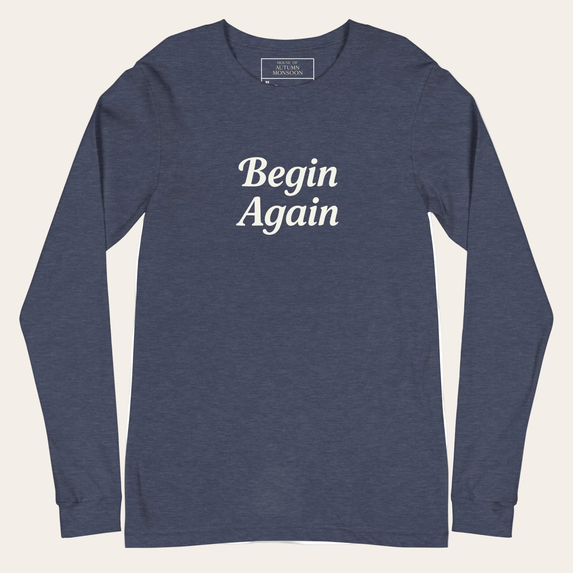 Navy long-sleeve shirt with 'Begin Again' text on a white background