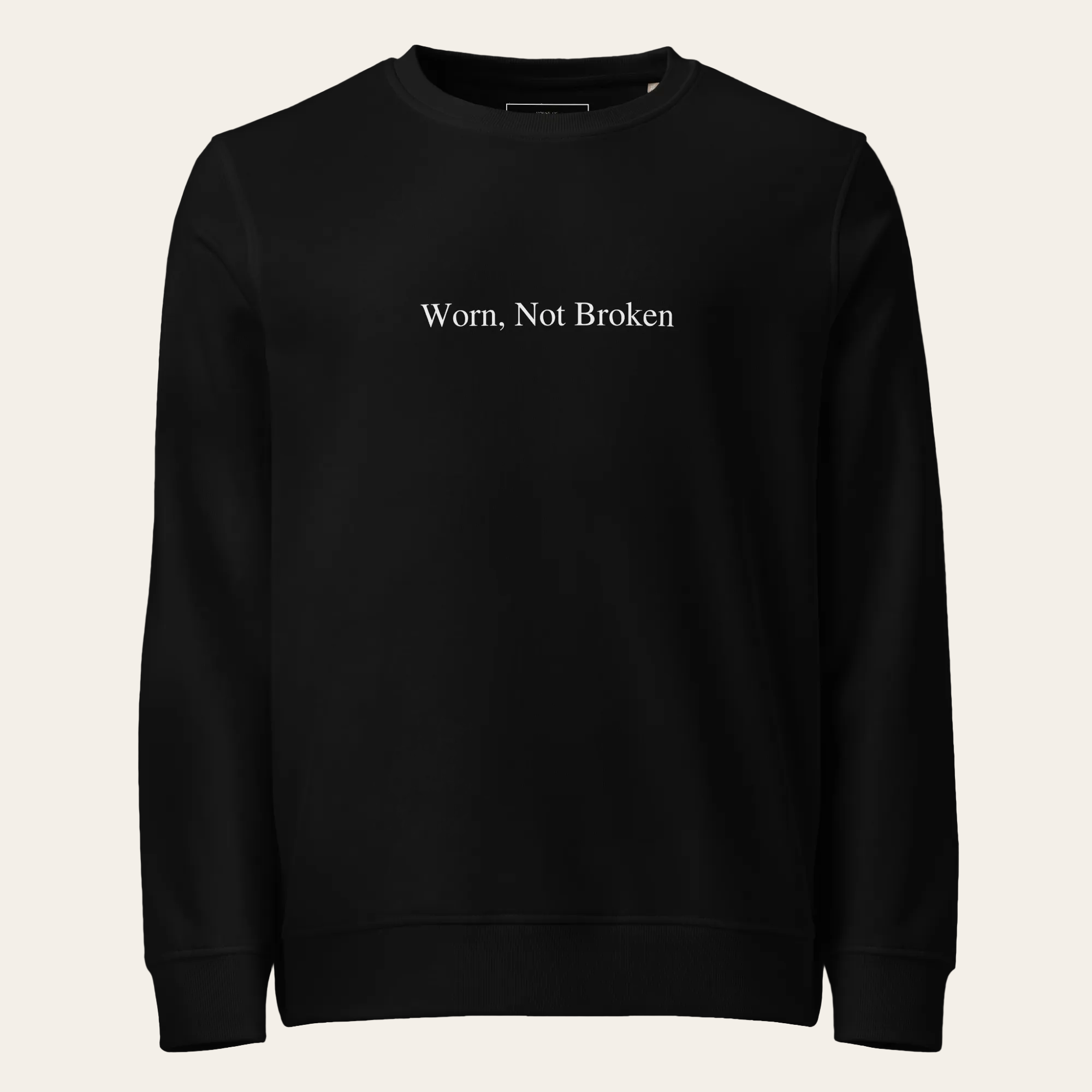 Black sweatshirt with 'Worn, Not Broken' text on a white background