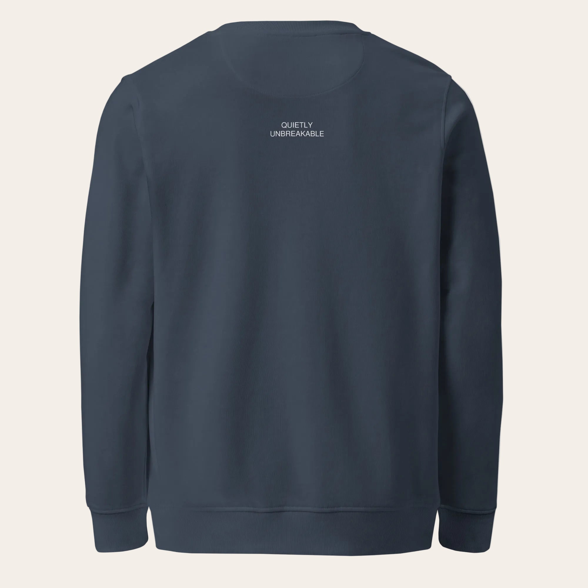 Navy blue sweatshirt with 'QUIETLY UNBREAKABLE' text on the back against a white background