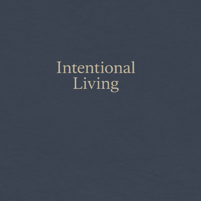 Navy blue sweatshirt with 'Intentional Living' text on a white background
