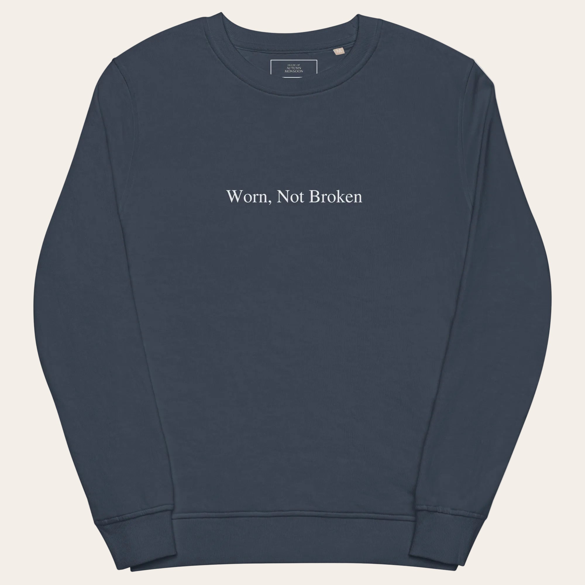 Navy blue sweatshirt with 'Worn, Not Broken' text on a white background