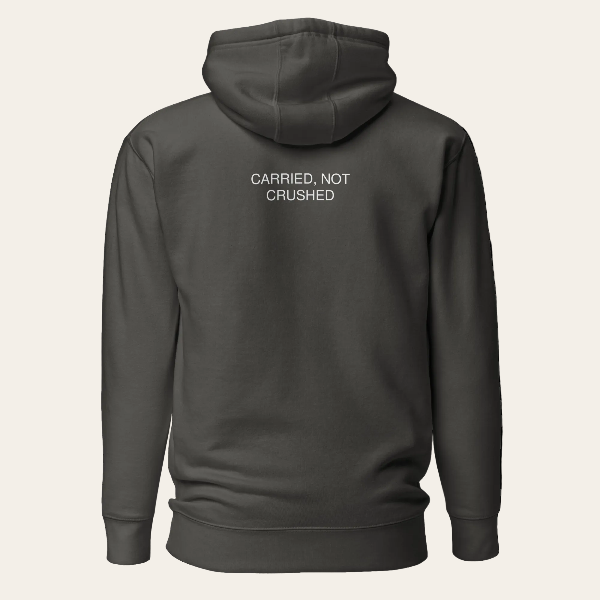 Dark gray hoodie with text 'CARRIED, NOT CRUSHED' on the back against a white background