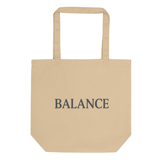 Beige tote bag with 'BALANCE' text on a white background