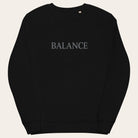 Black sweatshirt with 'BALANCE' text on a white background