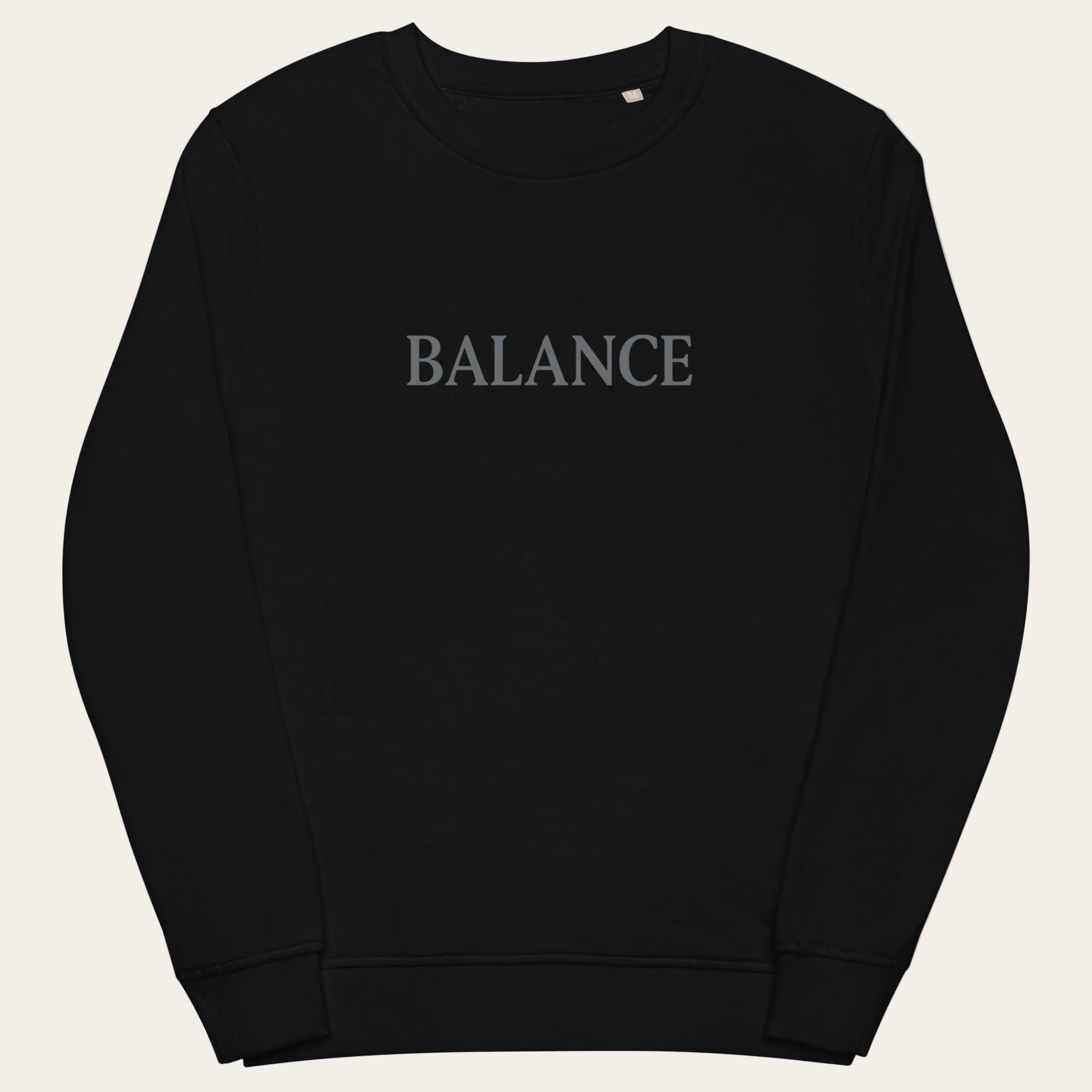 Black sweatshirt with 'BALANCE' text on a white background