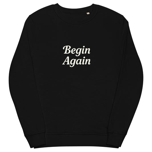 Black sweatshirt with 'Begin Again' text on a white background