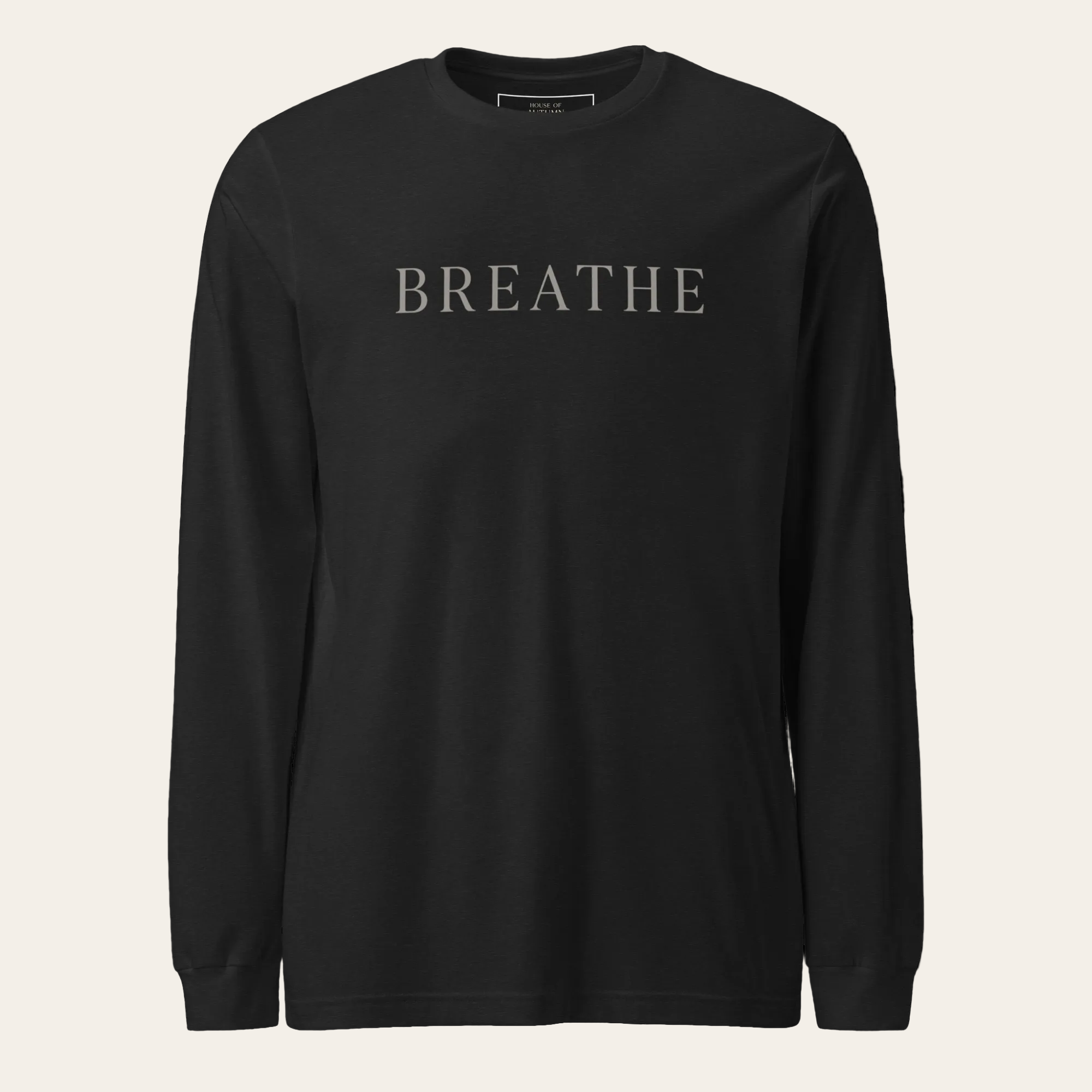 Black long-sleeve shirt with 'BREATHE' text on a white background