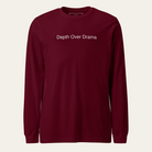 Maroon long sleeve tee with Depth Over Drama on the center chest.