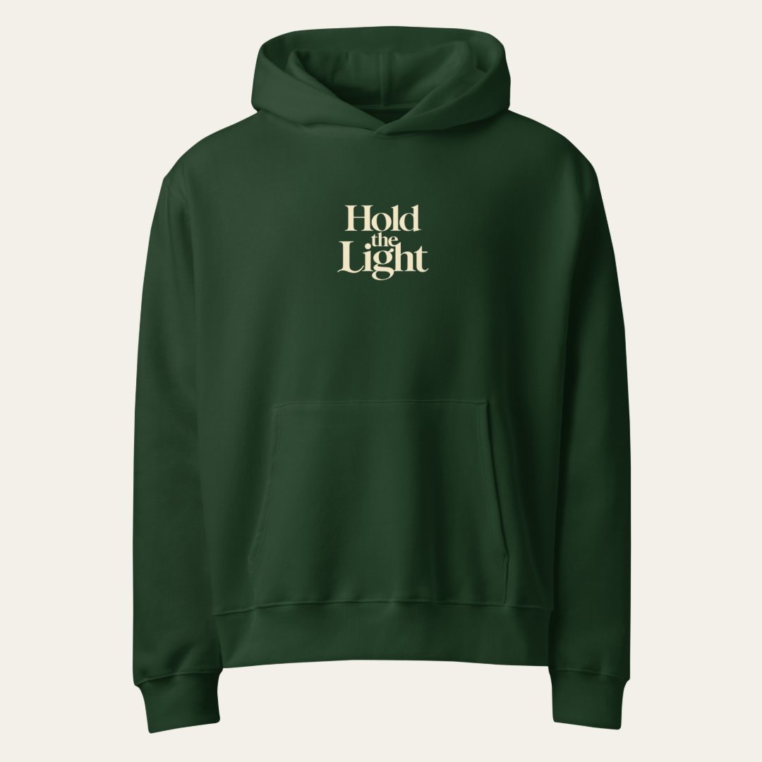 Forest green hoodie with Hold the Light on the center chest.
