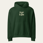 Forest green hoodie with Hold the Light on the center chest.