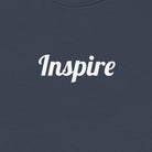 Navy blue sweatshirt with 'Inspire' text on a white background
