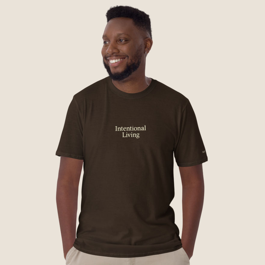 Man wearing a brown t-shirt with "Intentional Living" across the chest.
