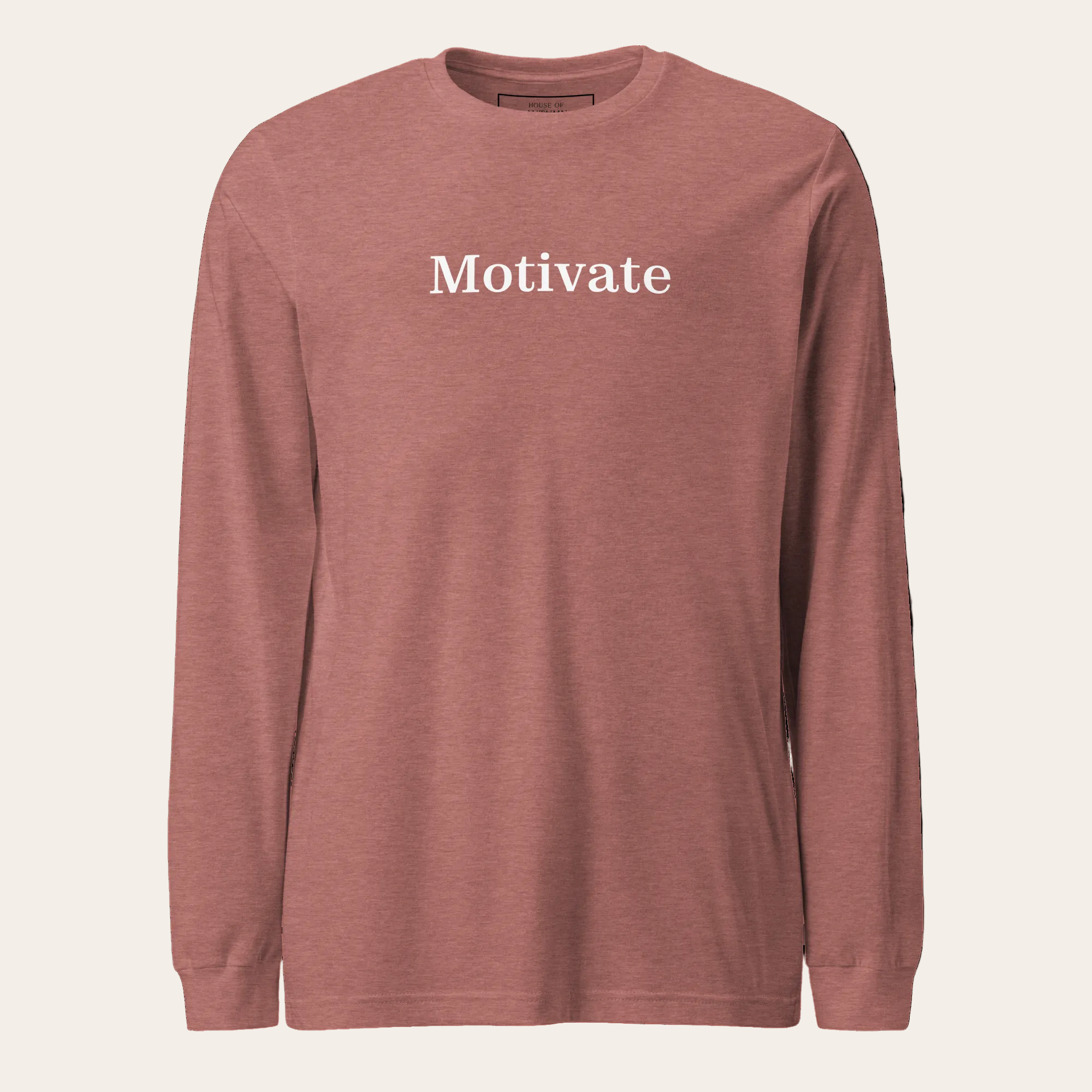 Heather mauve long sleeve tee with the word Motivate on the chest.