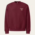 Maroon sweatshirt with Quiet Joy on the upper left chest
