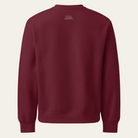 Back of a maroon sweatshirt with the House of Autumn Monsoon logo on the upper center back