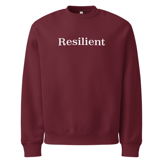 Maroon sweatshirt with 'Resilient' text on a white background