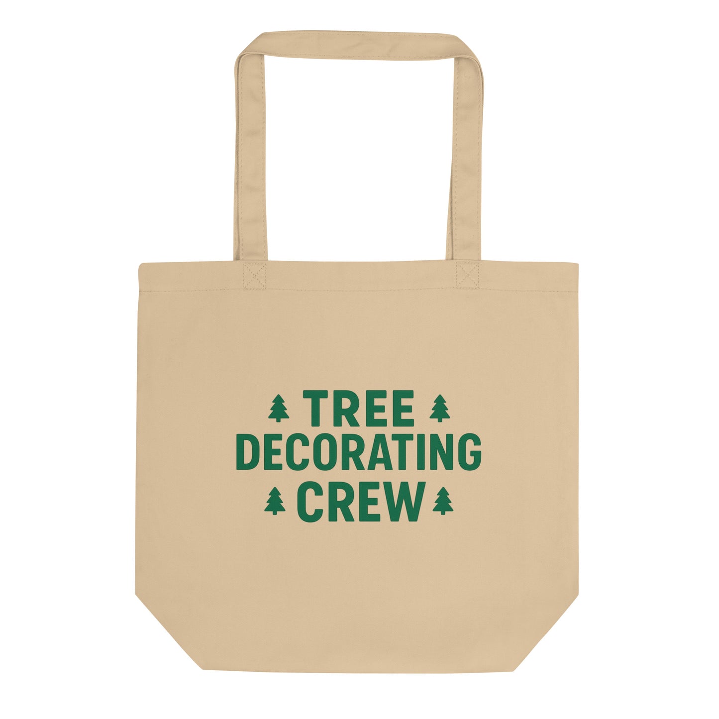 Beige tote bag with 'Tree Decorating Crew' text and Christmas tree icons on a white background
