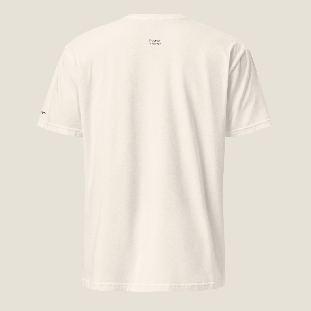 Back of a cream t-shirt. "Progress in Silence" is on the upper back.