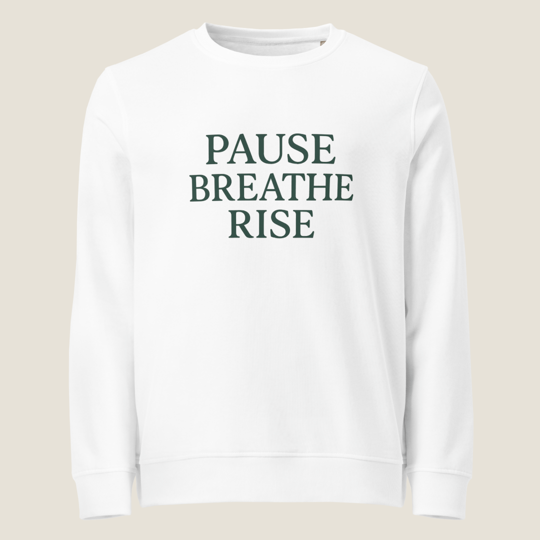 White sweatshirt with "PAUSE BREATHE RISE" on the front