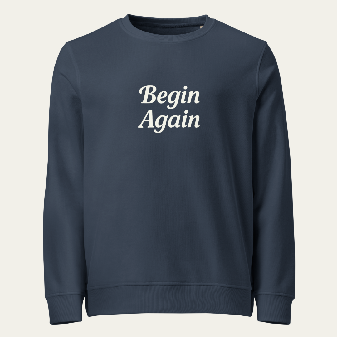 Navy sweatshirt with "Begin Again" on the front.