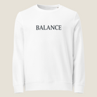 White crewneck sweatshirt with "BALANCE" across the chest.
