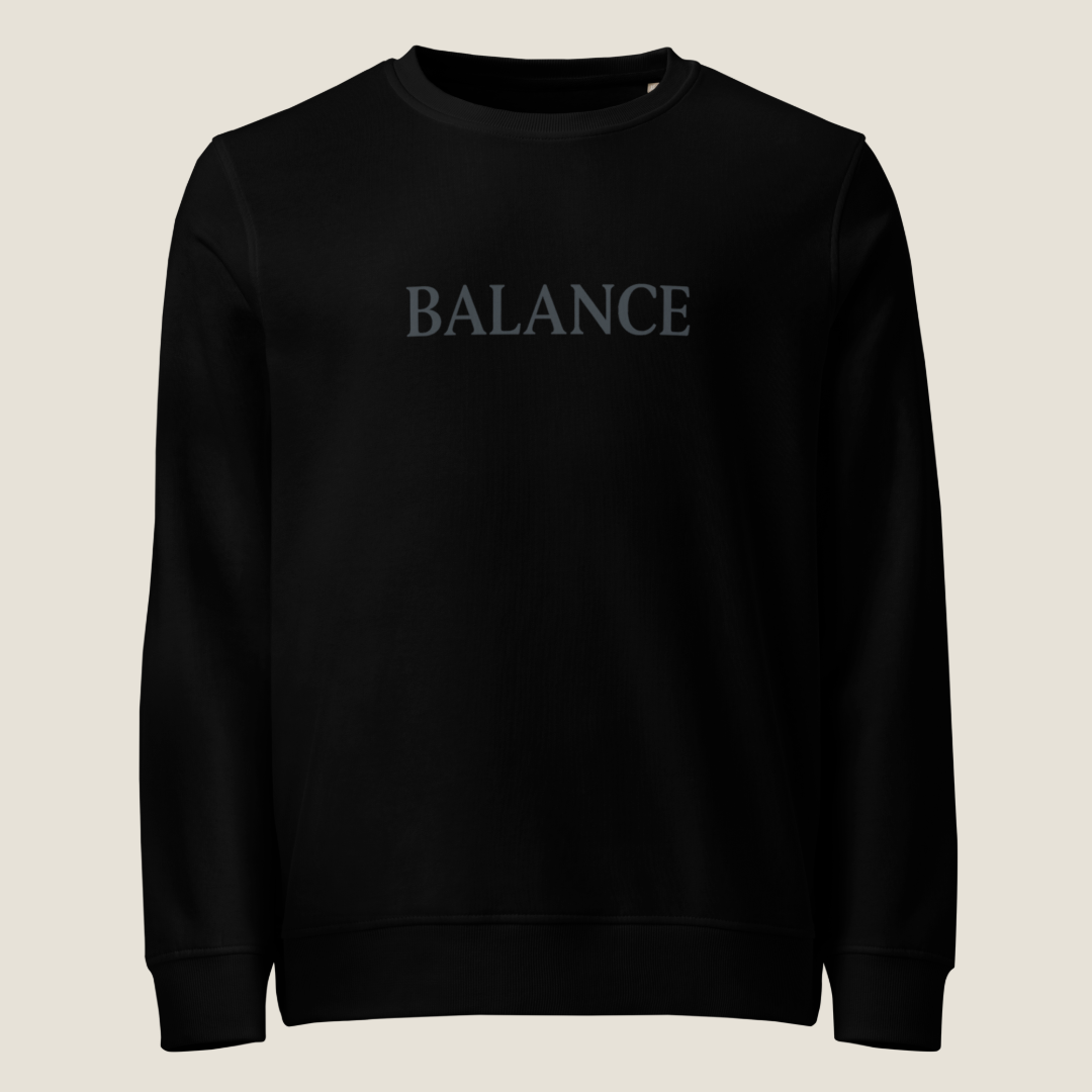Black crewneck sweatshirt with "BALANCE" across the chest