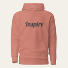 Dusty rose hoodie with the word "Inspire" on the chest.