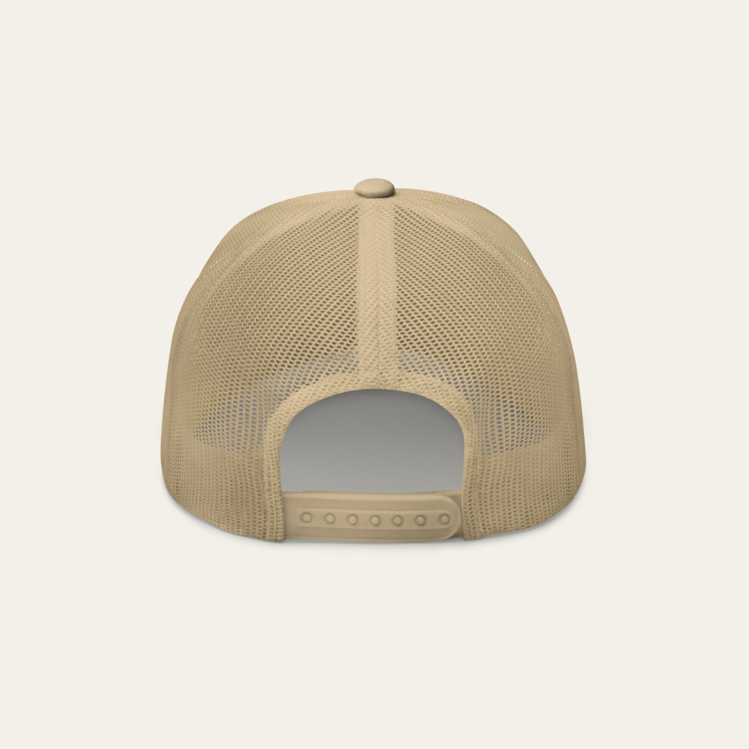 The back view of a beige mesh trucker cap on a light off-white background.
