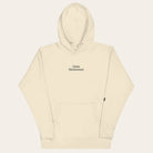 Beige hoodie with 'The Quiet Moment' logo on a white background