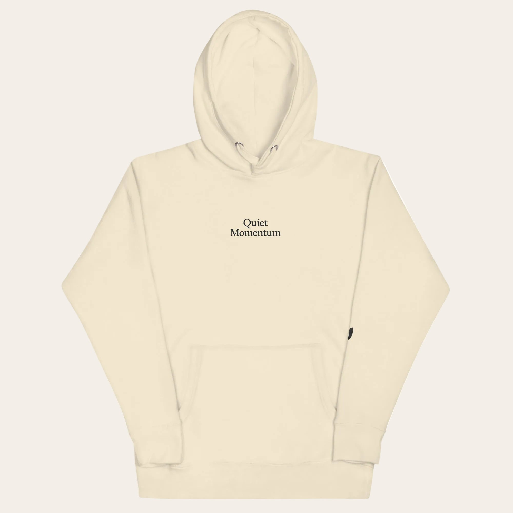 Beige hoodie with 'The Quiet Moment' logo on a white background