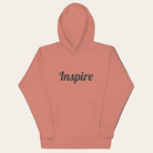 Coral hoodie with 'Inspire' text on a white background