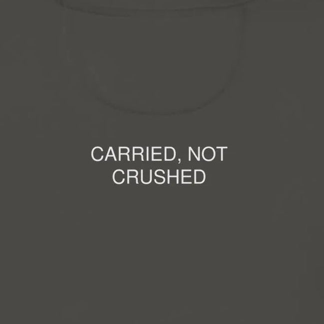Dark gray hoodie with 'CARRIED, NOT CRUSHED' text on the back against a light beige background